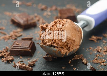 Homemade chocolate ice cream on a black slate plate. Selective focus Stock Photo