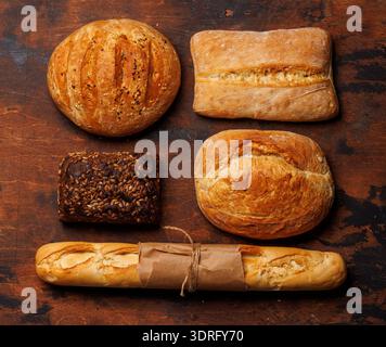 An assortment of freshly baked bread displayed on a table Stock Photo