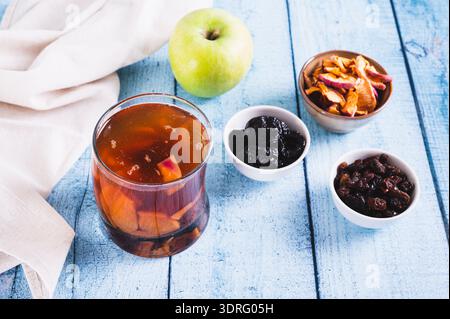 Sweet dried fruit compote in a glass on the table Stock Photo