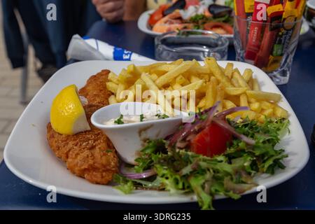 This is a classic British dish of fish and chips. Stock Photo