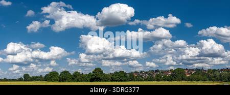 Panoramic view of the blue sky slightly overcast with cumulus clouds, cumulus clouds or fair weather clouds and fleecy clouds ab Stock Photo