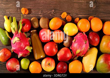 Banner with tropical exotic fruits on concrete background, summer vacation and healthy lifestyle concept. Advertising card for m Stock Photo