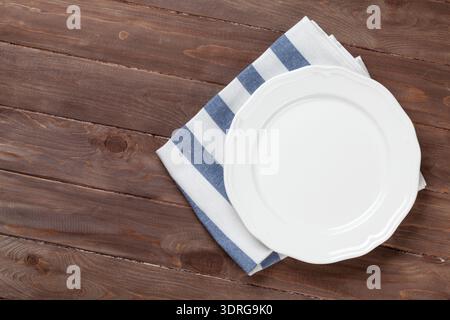 Empty plate over wooden table background Stock Photo