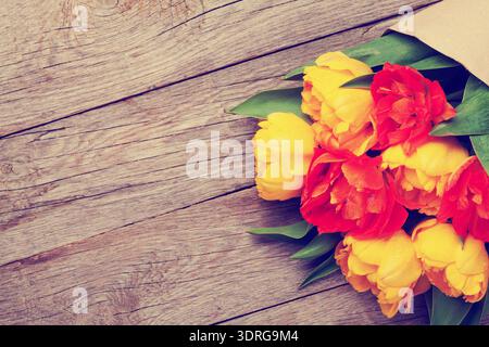 Colorful tulips over wooden table Stock Photo