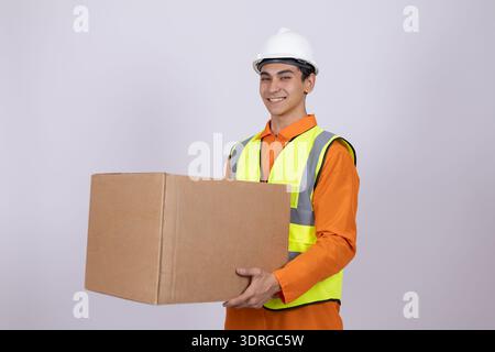 Courier holding a parcel and looking at camera Stock Photo