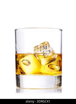 A classic whiskey glass filled with golden amber whiskey Stock Photo