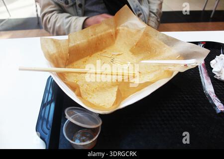 A tray with dirty dishes is on the table. Cleaning tables in a cafe. Stock Photo