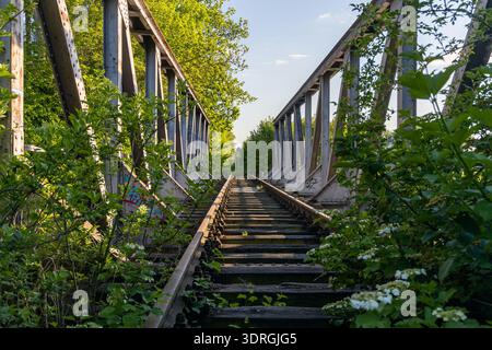 Old steel railroad bridge over a river Stock Photo