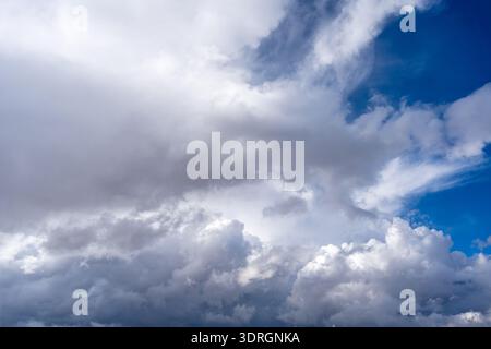 Dark storm clouds with patches of blue sky visible Stock Photo