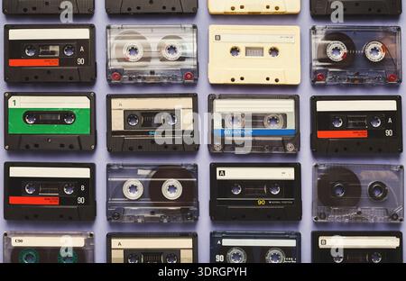 Collection of Various Cassette Tapes Arranged in a Grid Pattern Showcasing Music History Stock Photo