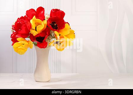 Still life with beautiful spring blooming tulips in vase on elegant background. Abstract flower arrangement and banner for scree Stock Photo