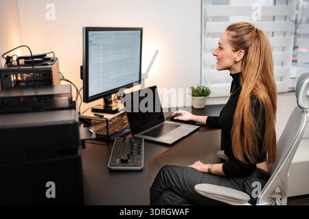 Young woman concentrating on working from home office Stock Photo