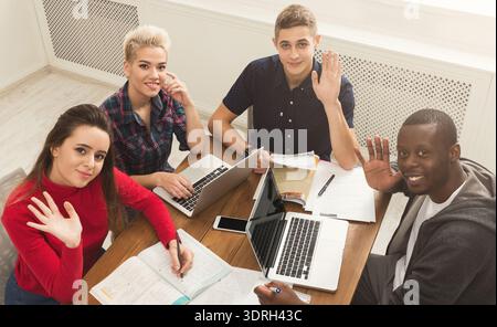Group of Students Studying Together and Sharing Ideas in a Cozy Space Stock Photo