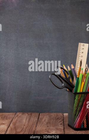 School and office supplies on classroom table Stock Photo