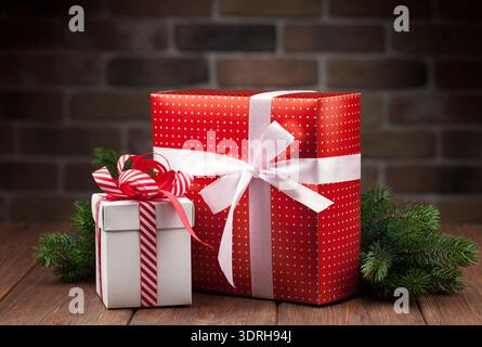 Christmas gift boxes and tree branch Stock Photo