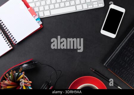 Office leather desk with pc and supplies Stock Photo