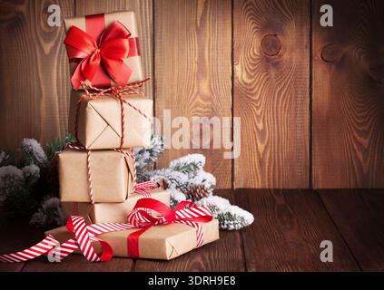 Christmas gift boxes and tree branch Stock Photo