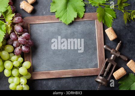 Red and white grapes and chalkboard for your text. Top view with copy space Stock Photo
