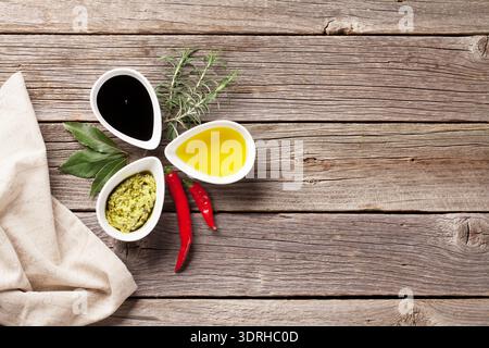 Herbs, condiments and spices on wooden background. Top view with copy space Stock Photo