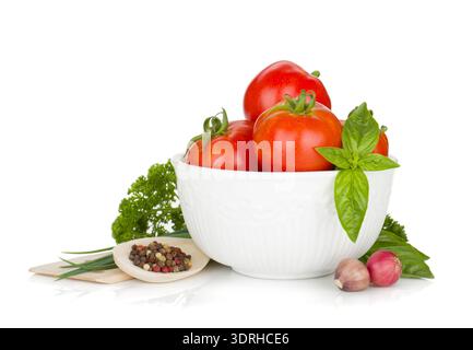 Ripe tomatoes, basil, parsley, onion and spices. Isolated on white background Stock Photo