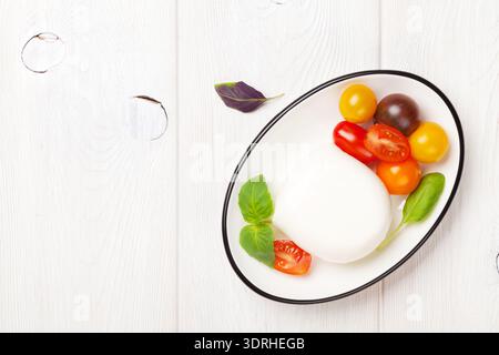 Mozzarella, tomatoes and basil Stock Photo
