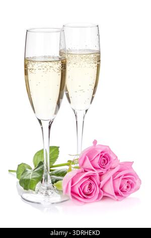 Two champagne glasses and pink rose flowers Stock Photo