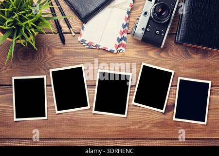Blank photo frames, camera and supplies Stock Photo