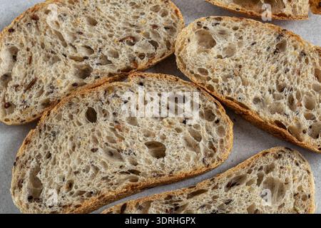 Slices of homemade seeded multigrain sour dough bread, top view Stock Photo