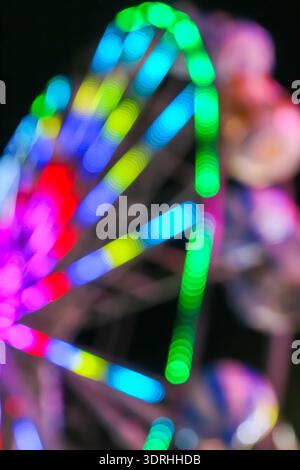Vertical abstract background with rainbow light bokeh and glowing trails. Ideal for mobile wallpapers and artistic digital posters. Stock Photo