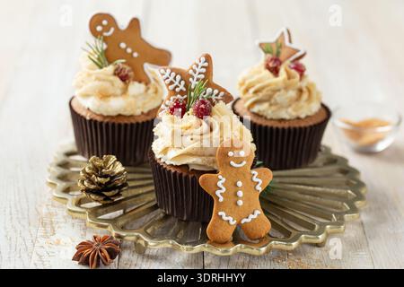 Christmas  cupcakes with gingerbread  cookies Stock Photo