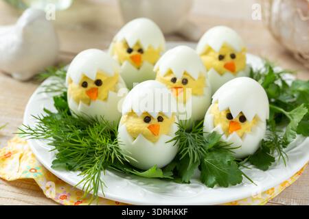 Funny eggs chicks. Easter idea for breakfast Stock Photo