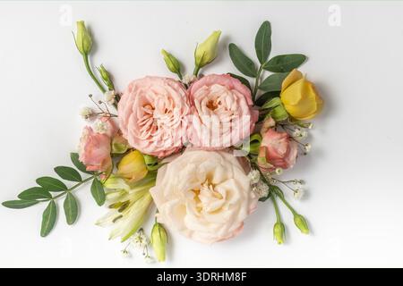 floral layout of pink roses on a soft blue background. Top view  Stock Photo