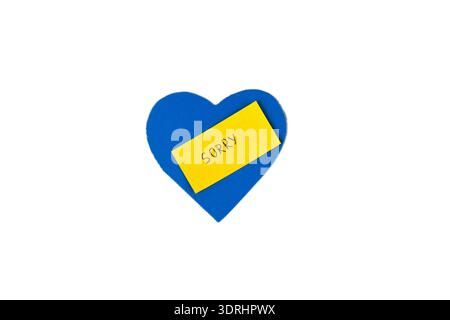 Blue heart shape with yellow paper note saying “Sorry” isolated on white background. Apology concept, relationship forgiveness message, emotional comm Stock Photo