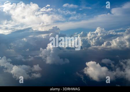 Dramatic sky with sunbeams and clouds seen from an airplane Stock Photo
