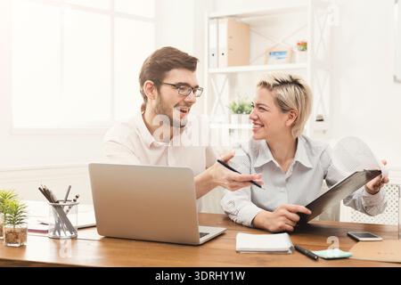 Collage of Two People Working Together in an Office Setting During Daytime Stock Photo