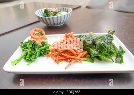 Colorful plate of fresh vegetables including greens, carrots Stock Photo