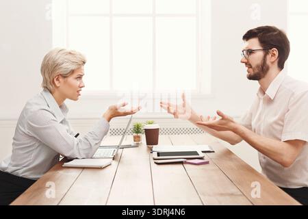 Discussion Between Two Professionals in an Office Setting About Work-Related Matters Stock Photo