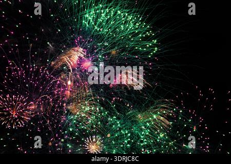 Fireworks on the dark sky background at festival. Stock Photo