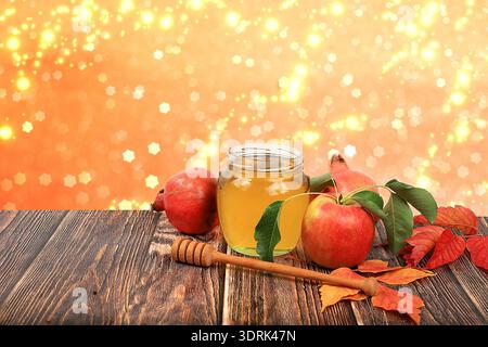 Autumn composition with apples, honey, pomegranate on an old wooden table. Harvesting concept, Jewish New Year Rosh Hashanah bac Stock Photo