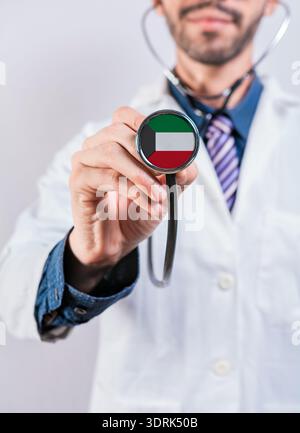 Kuwait health and medical insurance concept. Kuwait healthcare system, doctor holding stethoscope Stock Photo