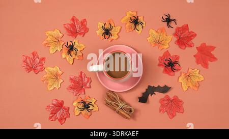 Autumn composition flat lay on seasonal background with maple leaves, coffee, spiders and bats. Happy Thanksgiving, halloween gr Stock Photo