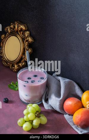 Natural sweetness at its finest: red fruits cut into different shapes (slices, halves, quarters) arranged in a circular pattern around a raspberry and Stock Photo