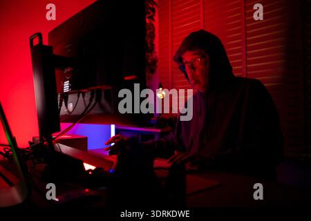 An expert hacker is decrypting data Stock Photo