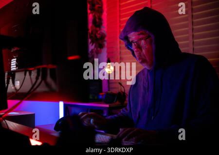 An expert hacker is decrypting data Stock Photo