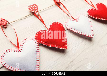 Collection of Heart-Shaped Decorations Arranged on a String for Celebration Stock Photo