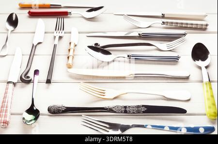 Collage of Diverse Cutlery Arranged on a Wooden Surface With a Focus on Design and Style Stock Photo