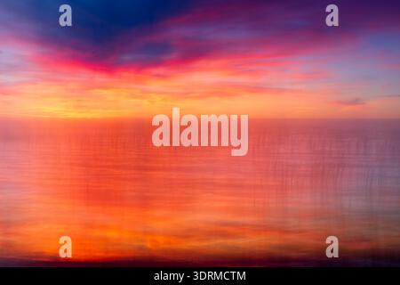 Abstract, camera motion blur photograph of sunset at Upper Red Lake, Minnesota, USA. Stock Photo