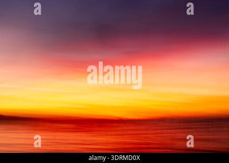 Abstract, camera motion blur photograph of sunset at Upper Red Lake, Minnesota, USA. Stock Photo
