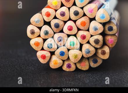 Collection of Colored Pencils Arranged in a Circle Showing Vibrant Tips and Wooden Bodies Stock Photo