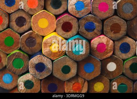 Colorful Collection of Hexagonal Pencils Arranged in a Neat Collage Pattern on a Flat Surface Stock Photo